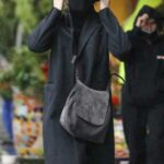 Cameron Diaz in a Black Hat Goes Shopping in the Rain with Benji Madden in Beverly Hills