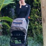 Karlie Kloss in a Black Cap Pushes Her Baby Boy Levi in His Stroller in Miami
