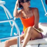 Lauren Silverman in an Orange Swimsuit on the Boat in Bridgetown