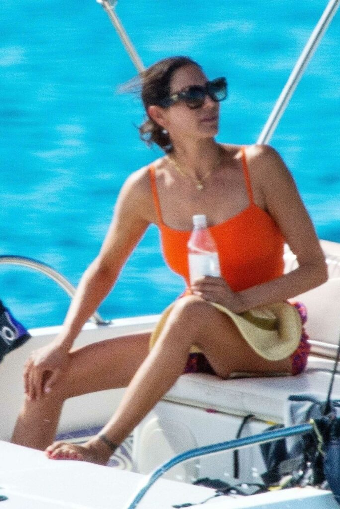 Lauren Silverman in an Orange Swimsuit