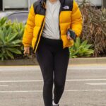 Mia Goth in a Yellow Puffer Jacket Attends Her Gym Session in Pasadena