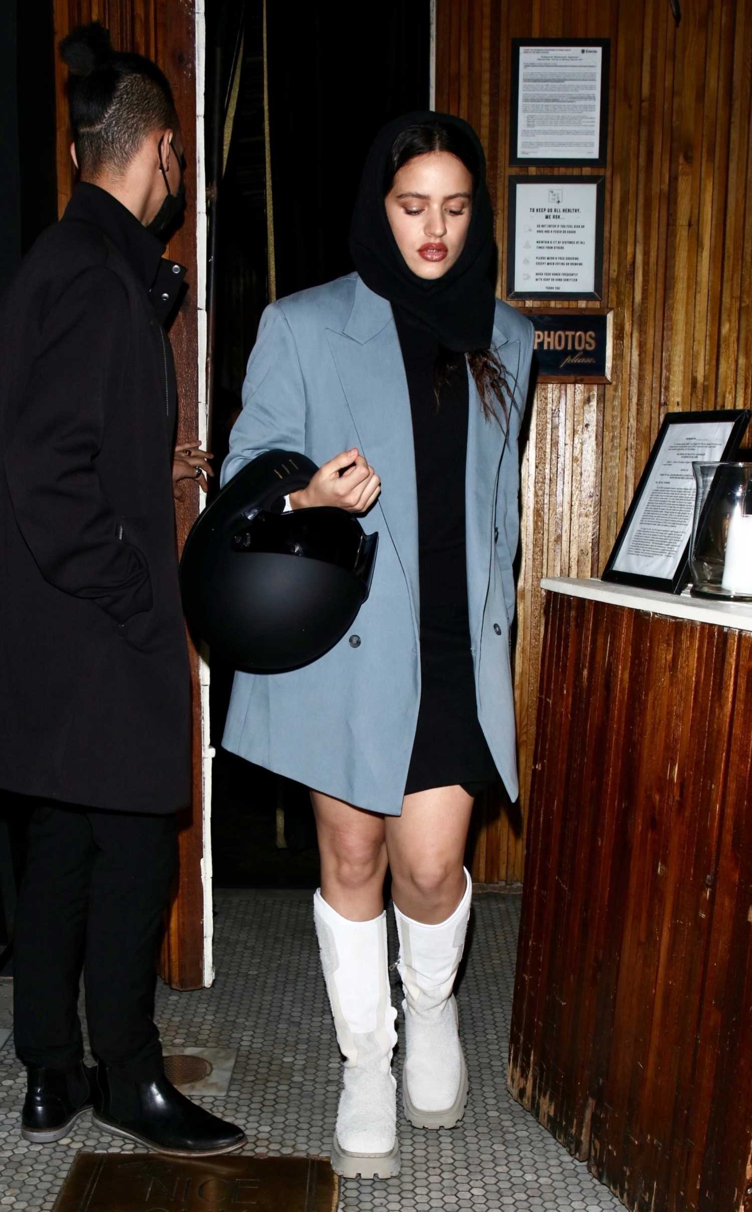 Rosalia in a Blue Blazer Holds a Helmet while Stepping Out to Dinner in