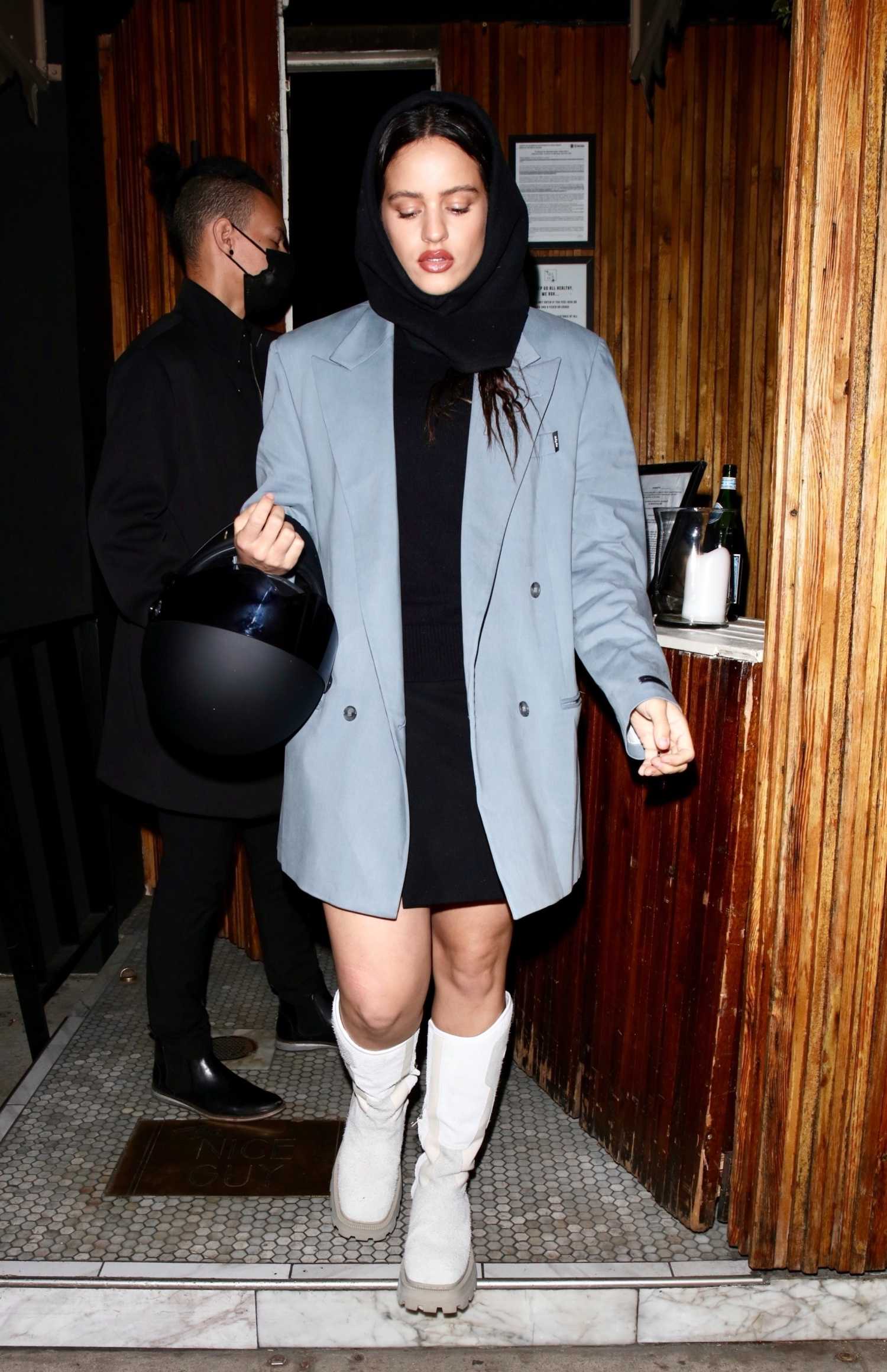Rosalia in a Blue Blazer Holds a Helmet while Stepping Out to Dinner in