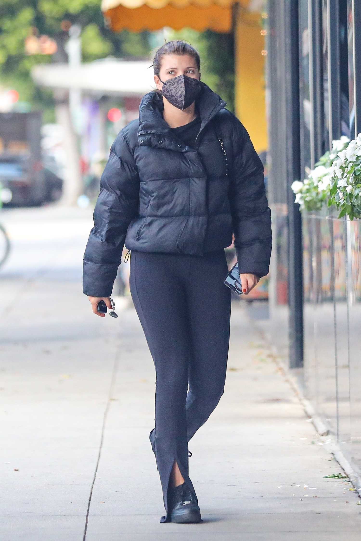 Sofia Richie in a Black Puffer Jacket Goes Shopping at XIV Karats in