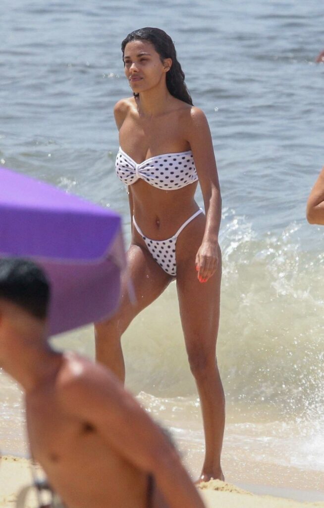 Tina Kunakey in a White Polka Dot Bikini