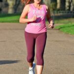 Amy Anzel in a Blue Sports Bra Does a Workout Session in Hyde Park in London