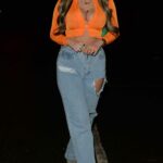 Belle Hassan in an Orange Blouse Heads for Dinner at Buddha Bar in Knightsbridge