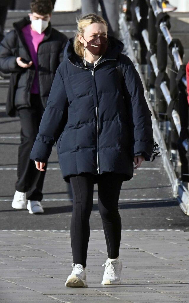Dakota Fanning in a Black Puffer Jacket