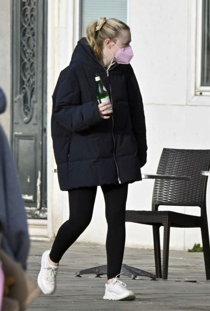 Dakota Fanning in a Pink Protective Mask
