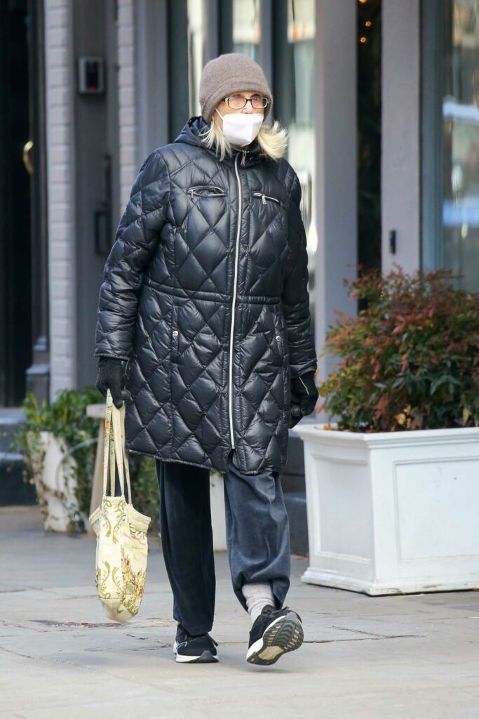 Jessica Lange in a Black Puffer Coat
