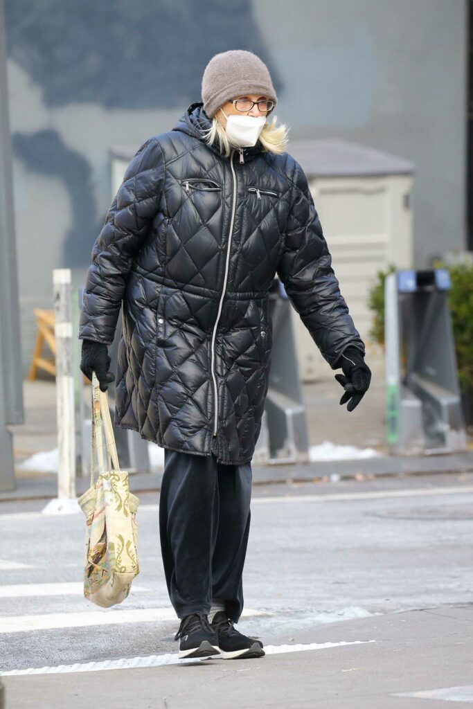 Jessica Lange in a Black Puffer Coat