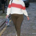 Malin Andersson in an Olive Leggings Arrives at a Business Meeting in London