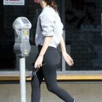 Meagan Camper in a Black Cap Grabs Coffee To-Go from Alfred in Los Angeles