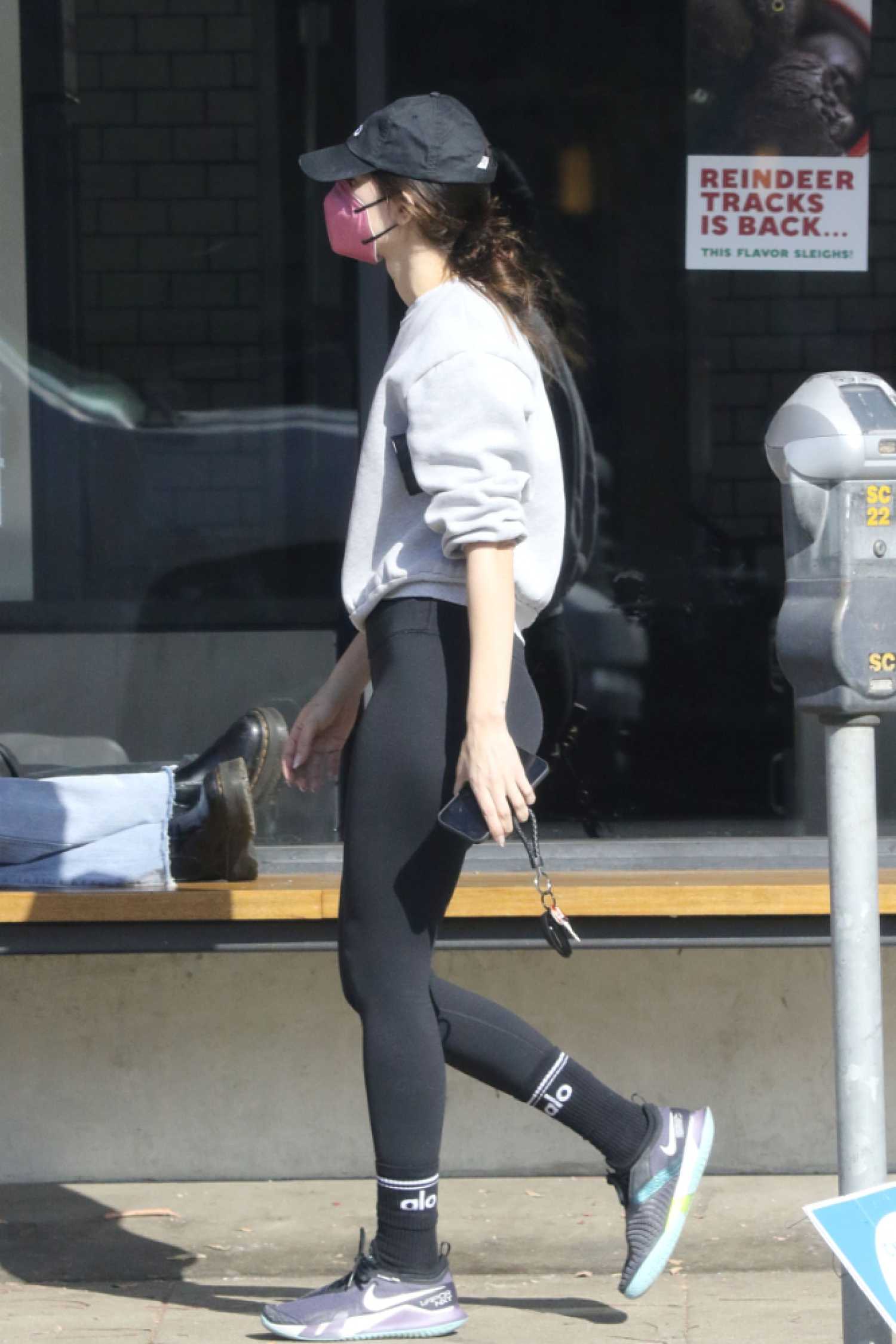 Meagan Camper in a Black Cap Grabs Coffee To-Go from Alfred in Los