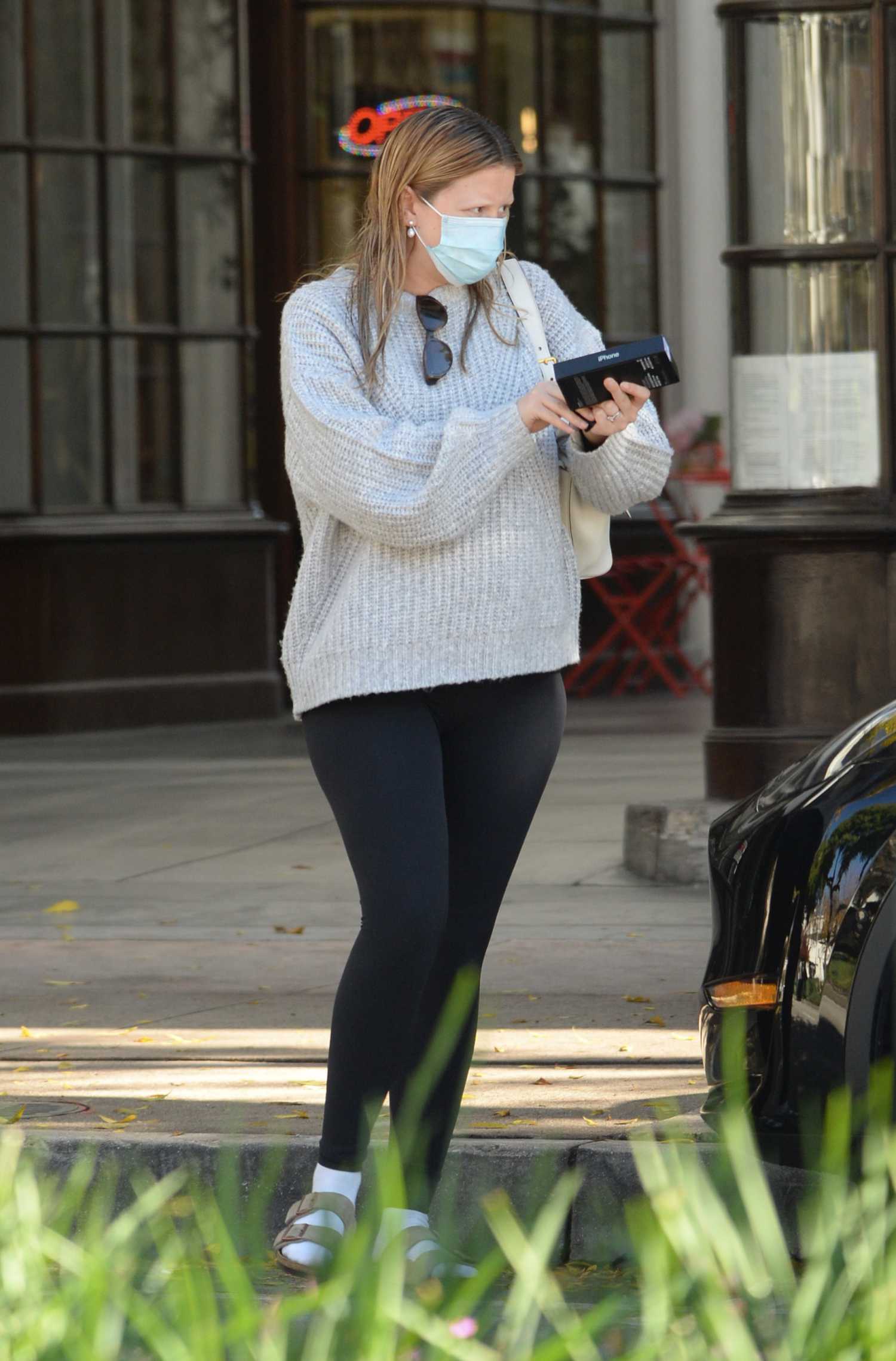 Mia Goth in a Grey Sweater Arrives at a Verizon Store in Pasadena