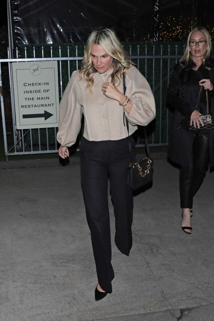 Molly Sims in a Beige Jacket