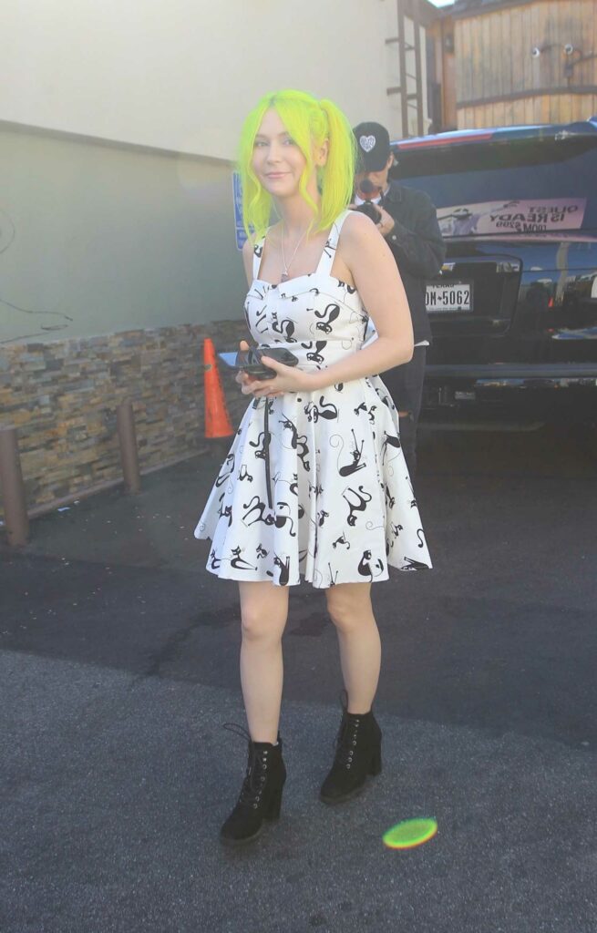 Nikki Paige in a Cat Print White Dress