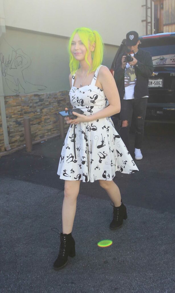 Nikki Paige in a Cat Print White Dress