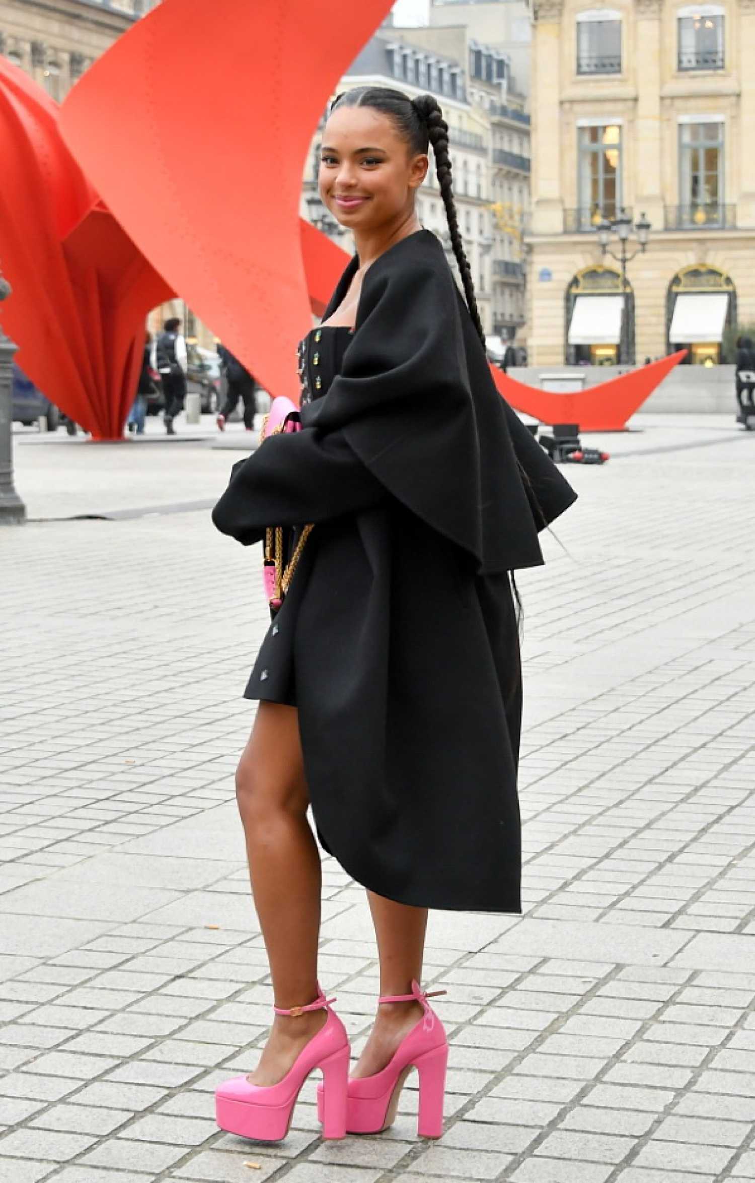 Paola Locatelli in a Black Coat Arrives at the Valentino Fashion Show