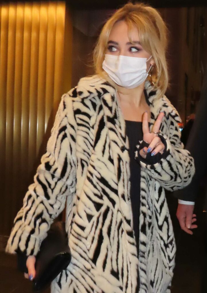 Sabrina Carpenter in a Zebra Print Fur Coat