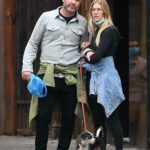 Taylor Neisen in a White Sneakers Walks Her Dog Out with Liev Schreiber in New York