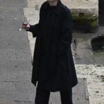Dakota Fanning in a Black Trench Coat on the Set of the Crime Drama Ripley in Venice