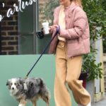 Helena Christensen in a Yellow Pants Walks Her Dog in New York
