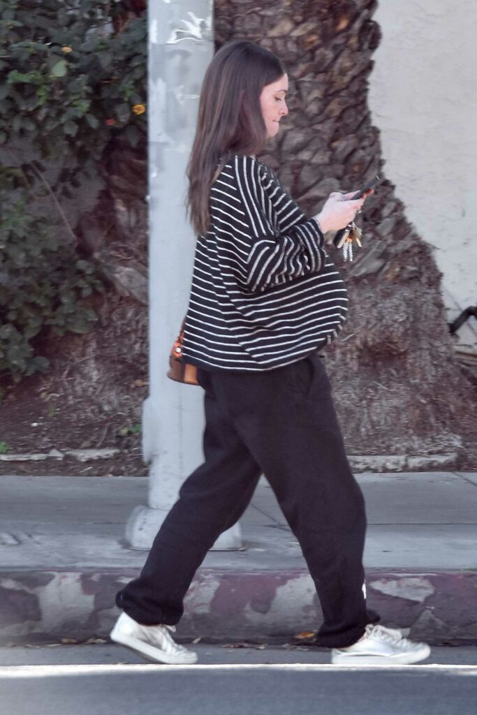 Lauren Parsekian in a Striped Sweater