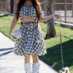 Phoebe Price in a Beige Hat Walks Her Dog in Los Angeles