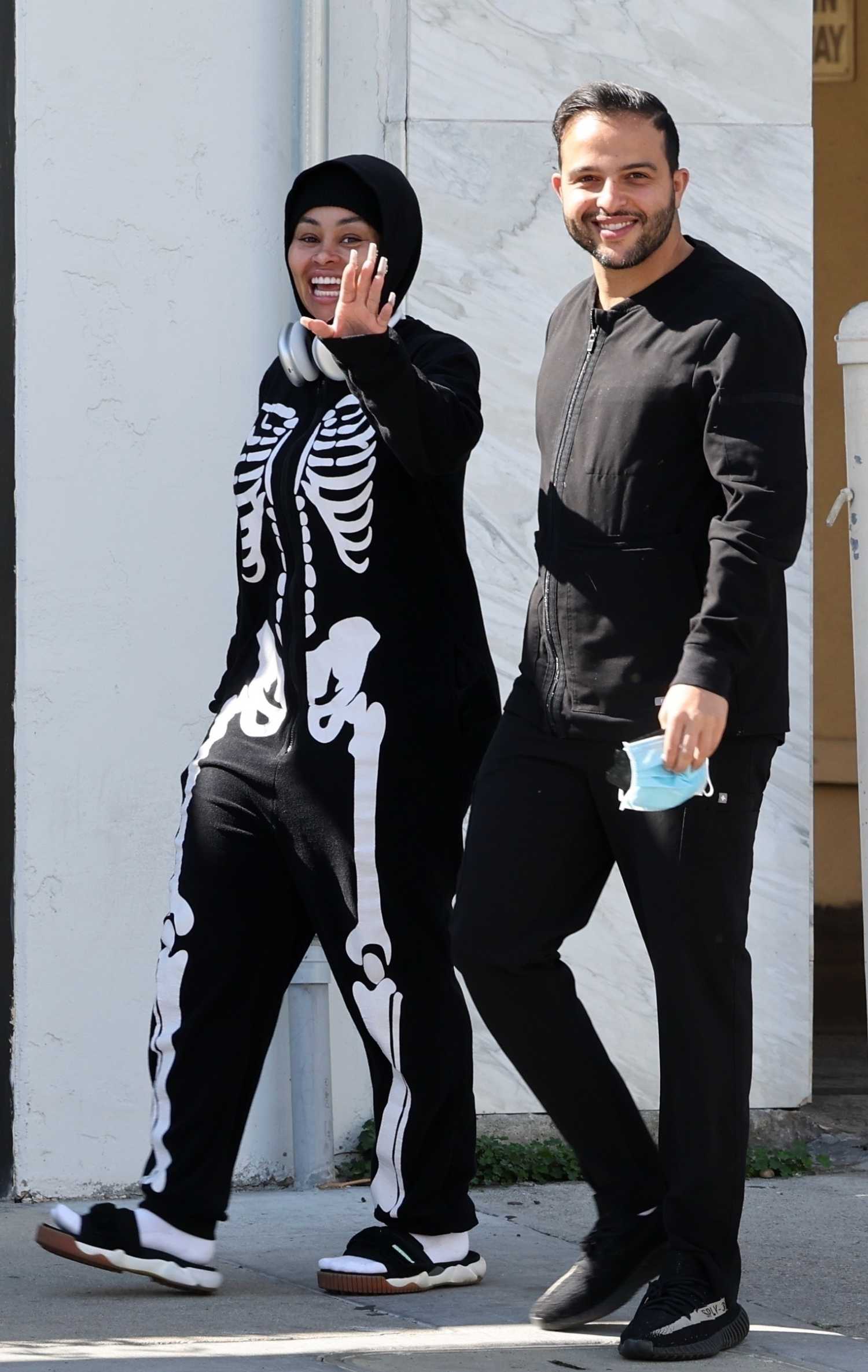 Blac Chyna in a Black Skeleton Print Catsuit Was Seen with a New Guy in