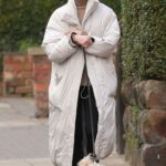 Phoebe Dynevor in a Beige Fur Coat Walks Her Dog in Greater Manchester