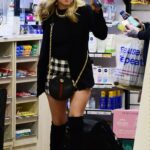 Tina O’Brien in a Black Mini Skirt Arrives at Euston Train Station in London