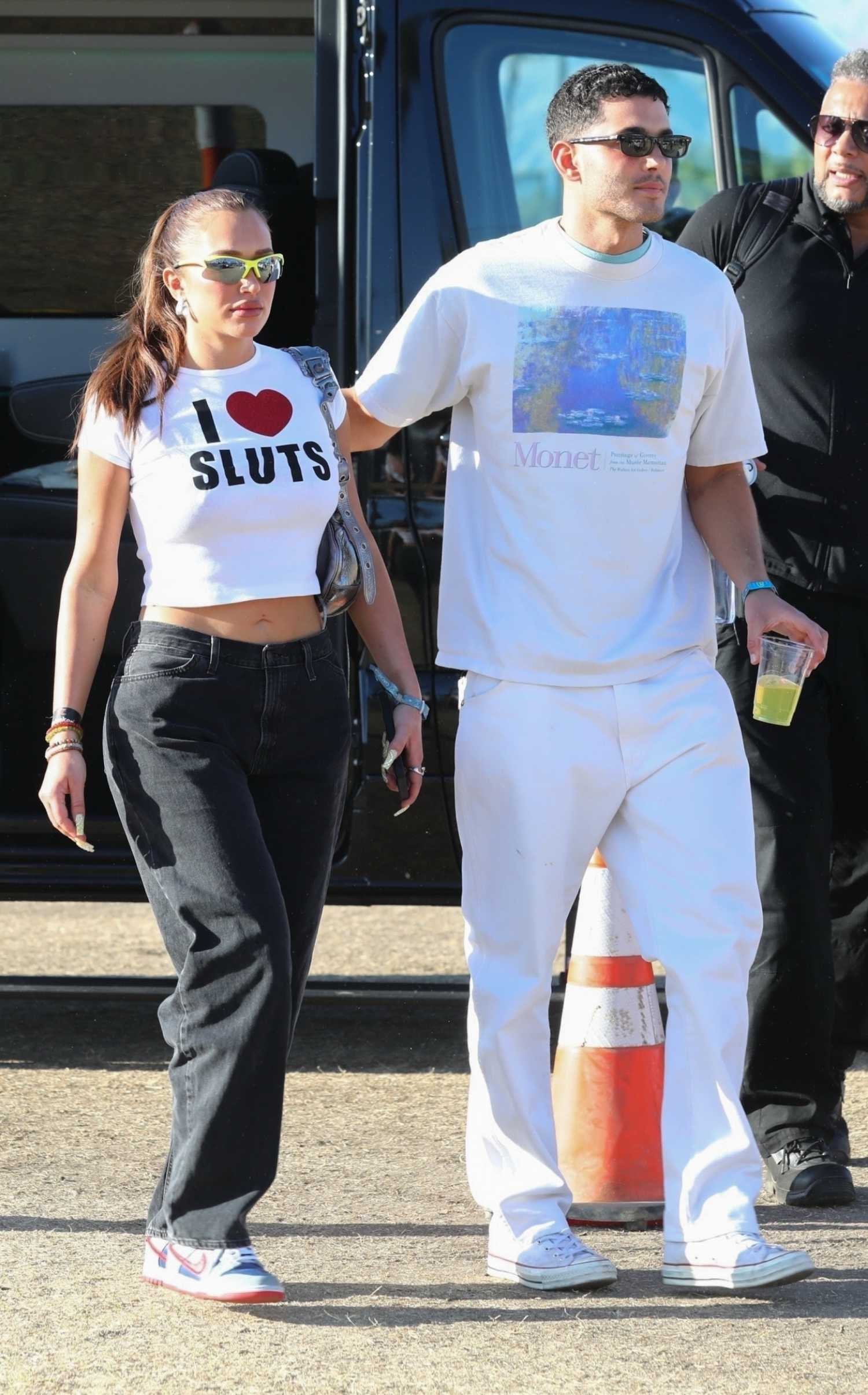 Anastasia Karanikolaou in a White Cropped Tee Arrives at 2022 Coachella