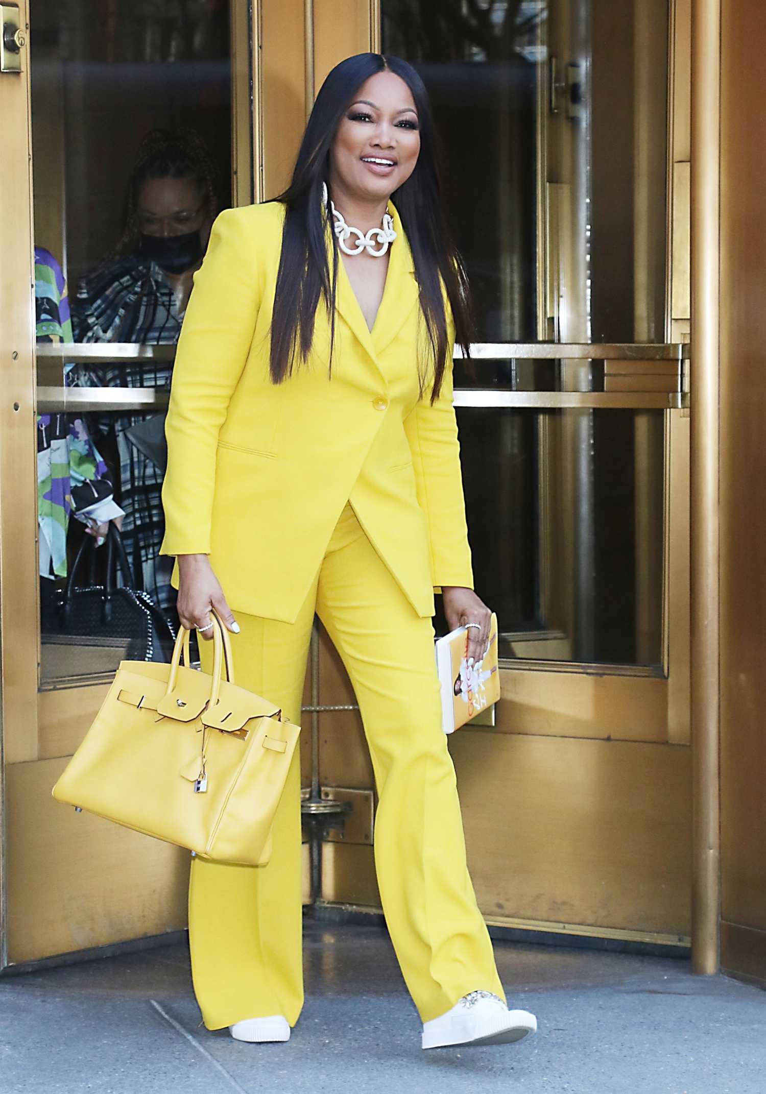 Garcelle Beauvais in a Yellow Pantsuit Leaves the CBS Studios in New