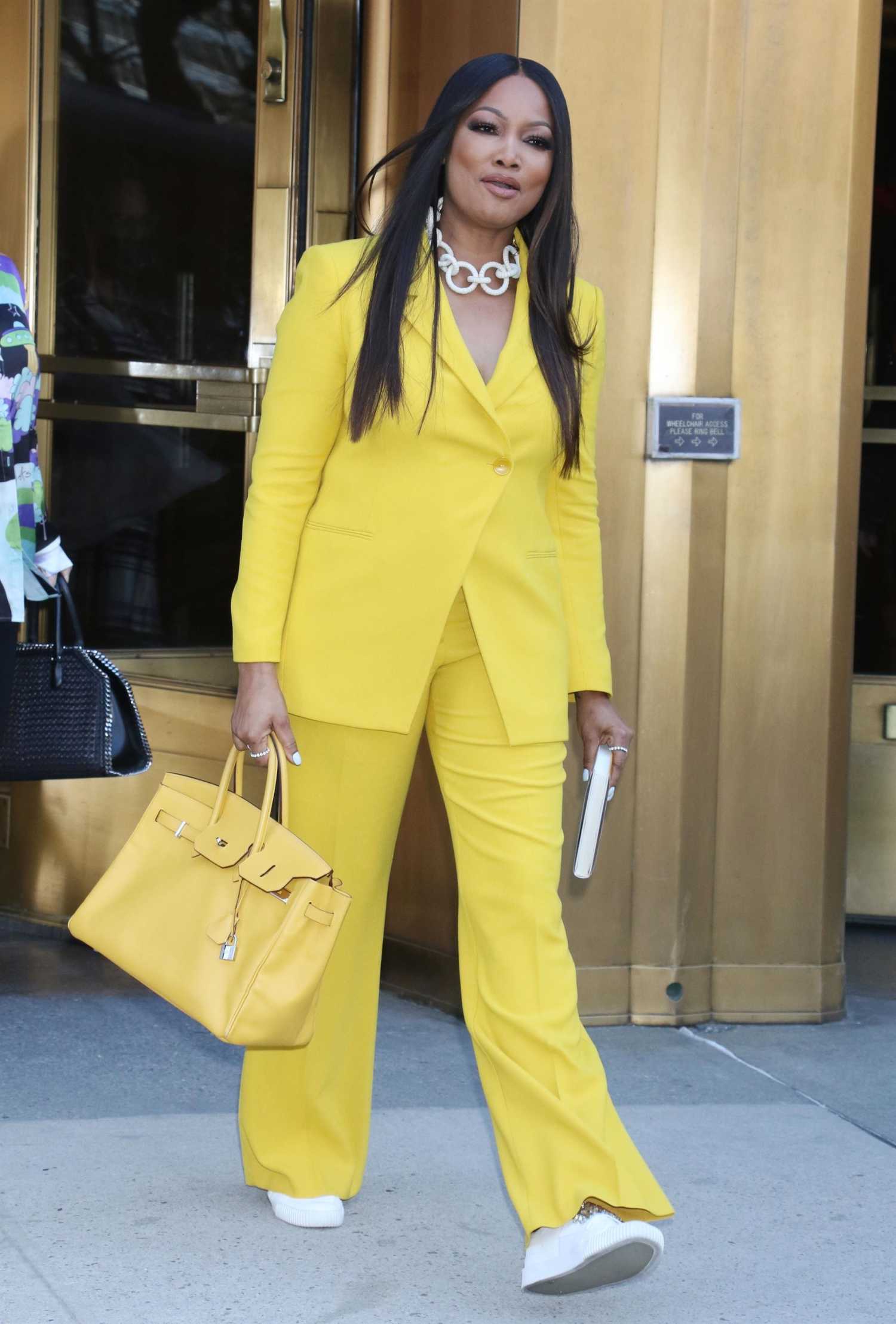 Garcelle Beauvais in a Yellow Pantsuit Leaves the CBS Studios in New