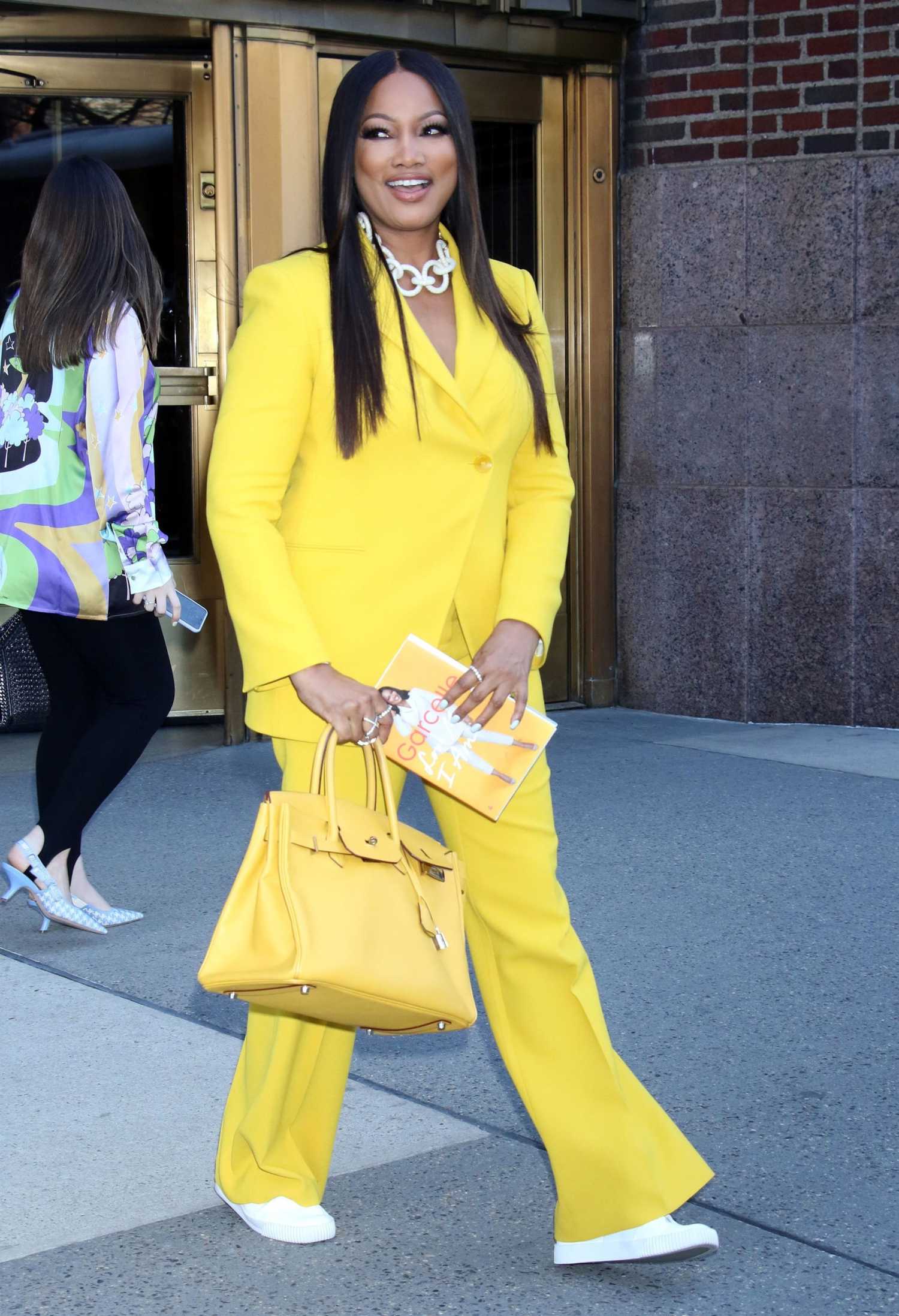 Garcelle Beauvais in a Yellow Pantsuit Leaves the CBS Studios in New