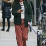 Helena Christensen in a Green Jacket Walks Her Dog in New York