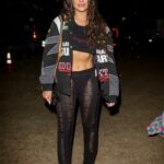 Madison Pettis in a Black Top Attends 2022 Coachella Valley Music And Arts Festival in Indio