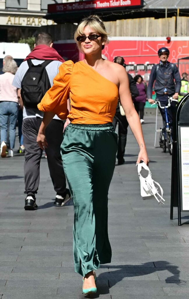 Ashley Roberts in an Orange Blouse