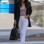 Eva Longoria in a White Jeans Arrives at the Airport in Nice