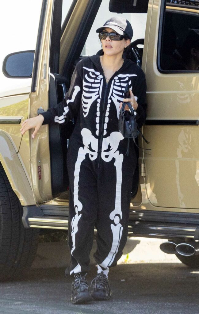 Kourtney Kardashian in a Skeleton Print Jumpsuit
