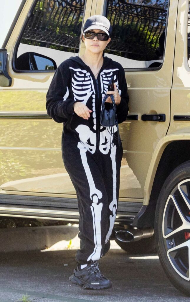 Kourtney Kardashian in a Skeleton Print Jumpsuit