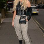 Demi Sims in a Beige Pants Arrives at the Prettylittlething Launch Party in London