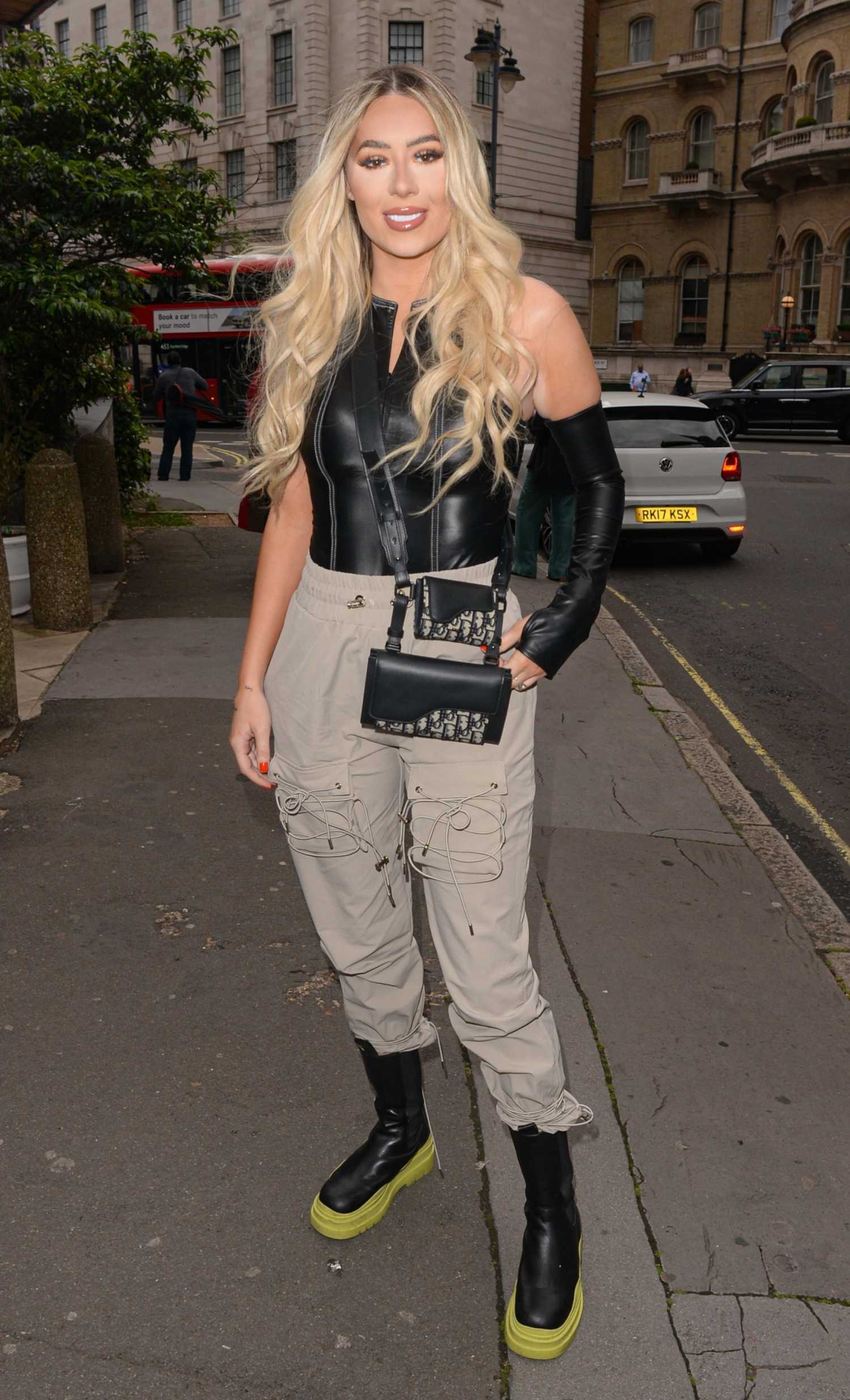 Demi Sims in a Beige Pants Arrives at the Prettylittlething Launch