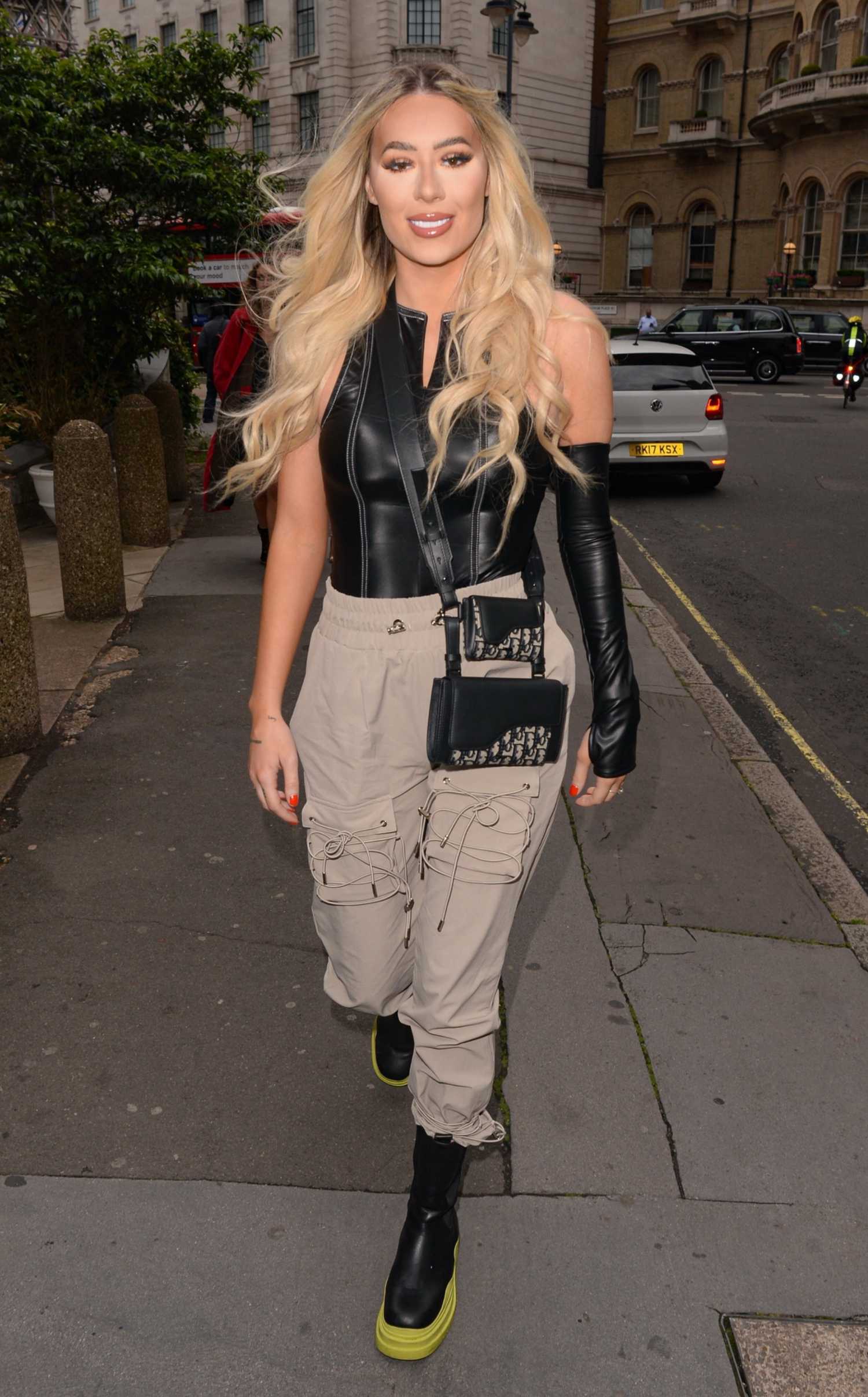 Demi Sims in a Beige Pants Arrives at the Prettylittlething Launch