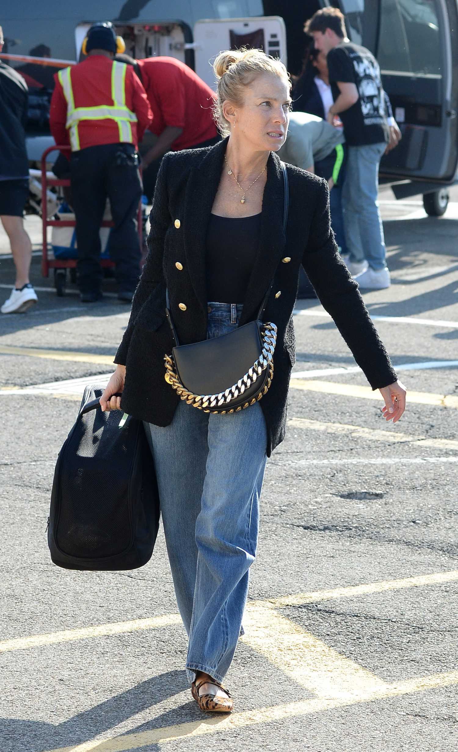 Jessica Seinfeld in a Black Blazer Arrives Aboard a Helicopter to New