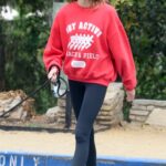 Kaia Gerber in a Red Sweatshirt Takes Her Dog Milo on a Hike in Los Angeles