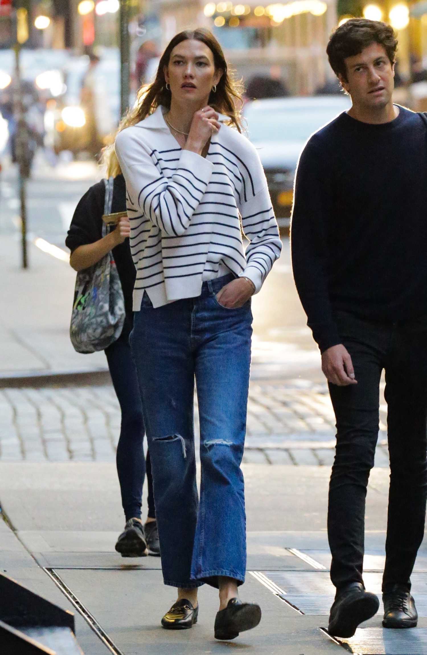 Karlie Kloss in a Blue Ripped Jeans Steps Out for Dinner with Joshua
