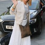 Kate Garraway in a White Skirt Arrives at the Global Radio Studios in London
