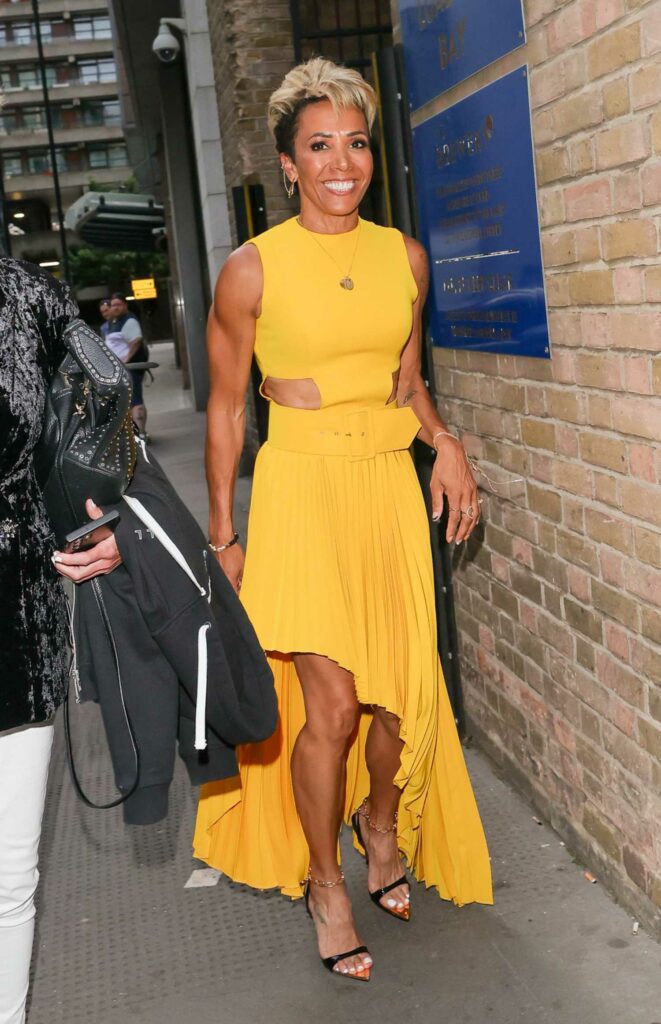 Kelly Holmes in a Yellow Dress
